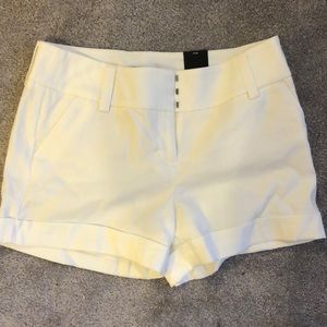 Express low-rise cream dress shorts